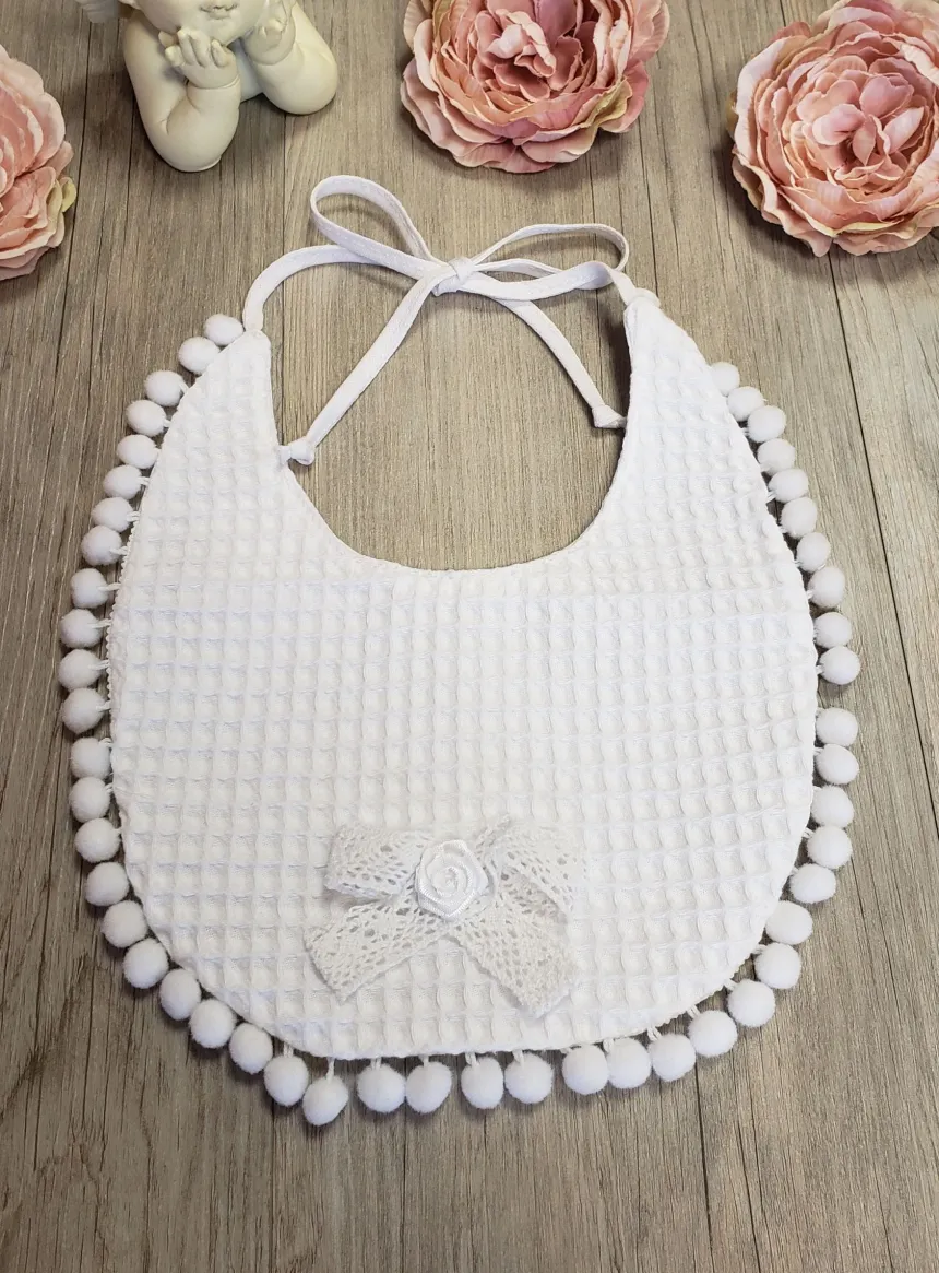 Bavoir pompon