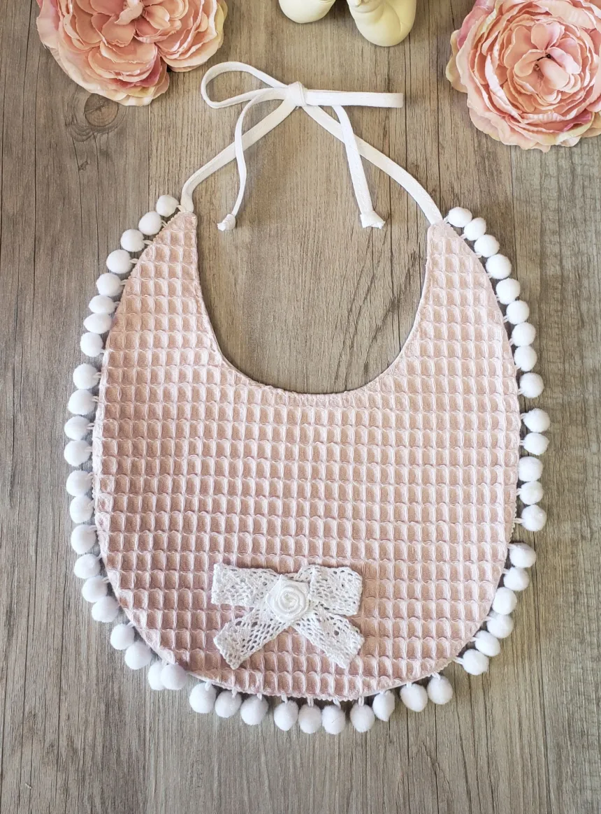 Bavoir pompon